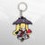 Image showcasing the cutout of the Rachel keychain, a piece of Blazblue merchandise, set against a pixelated background.