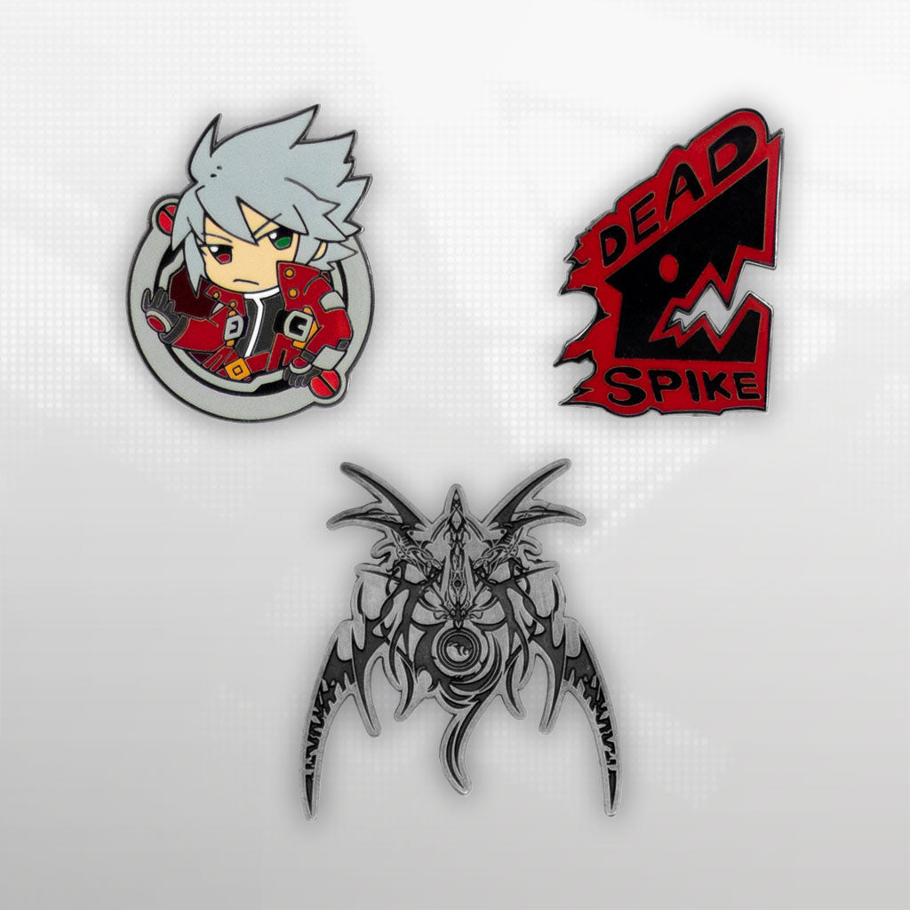 Image showcasing the Ragna pin set, part of the Blazblue merchandise collection, arranged on a pixelated background.