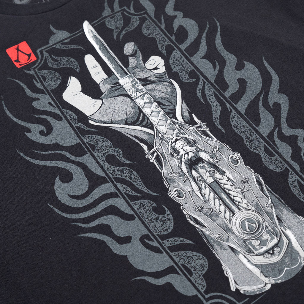 Closeup of Naoe’s Hidden Blade design on Assassin’s Creed Shadows shirt