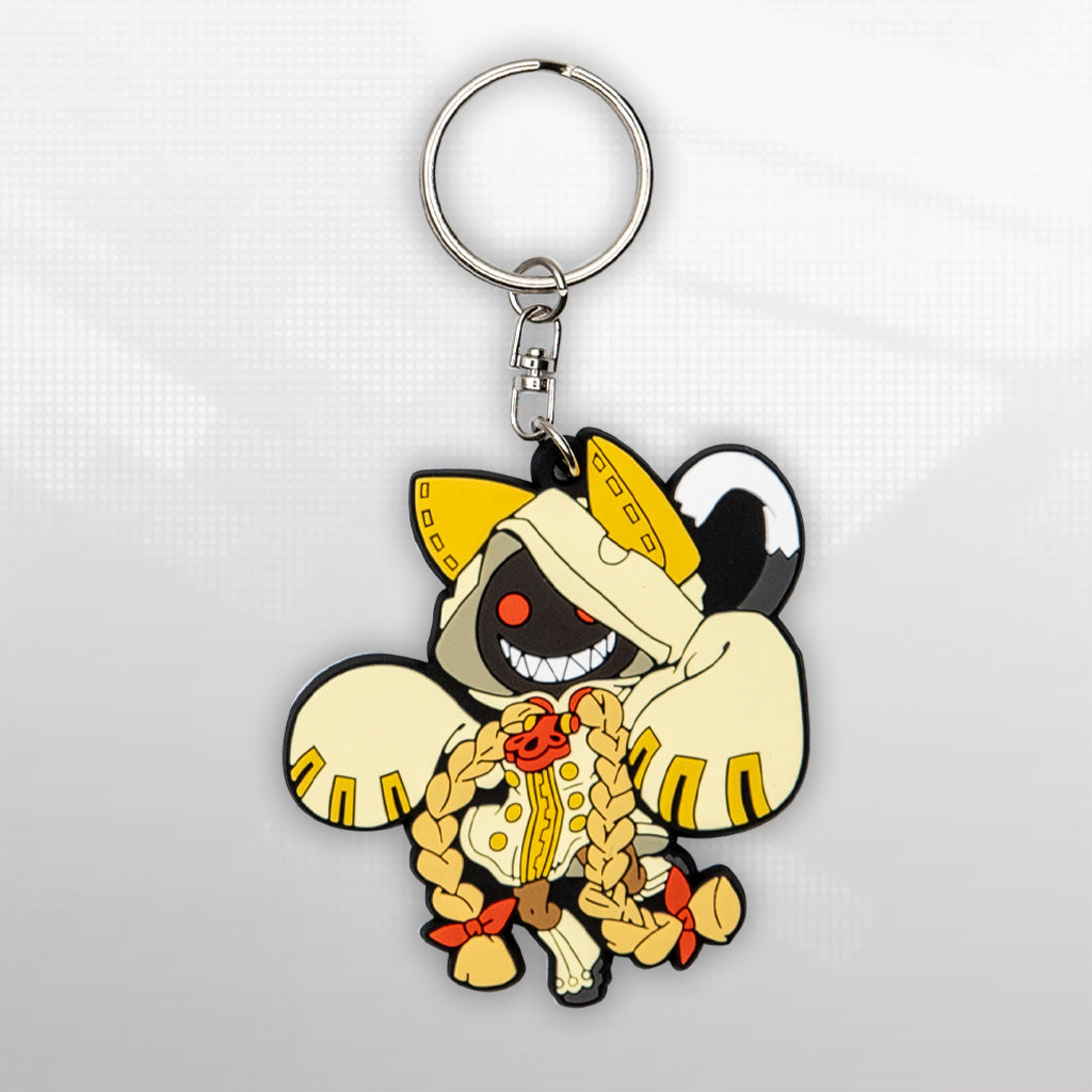 Image showcasing the cutout of the Taokaka keychain, a piece of Blazblue merchandise, set against a pixelated background.