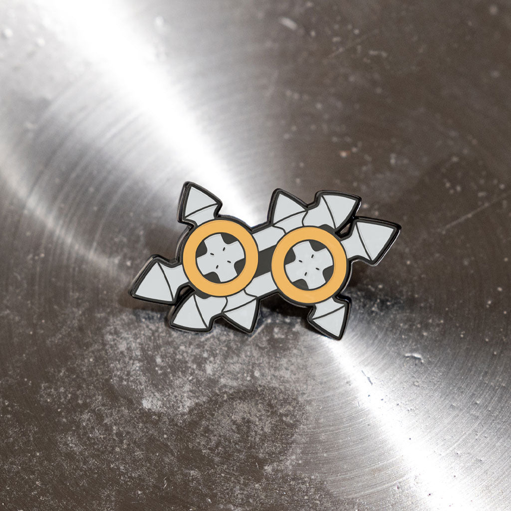 Photograph of Makoto&#39;s tonfa weapon, a character from BlazBlue, displayed inside a metallic bowl.