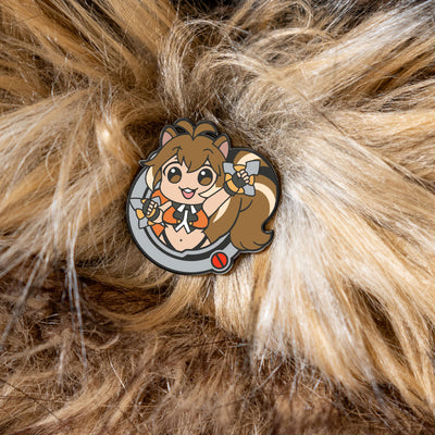 image of the Makoto pin from the BlazBlue Pin Set, placed on a bed of soft fur, highlighting its squirrel-like appearance