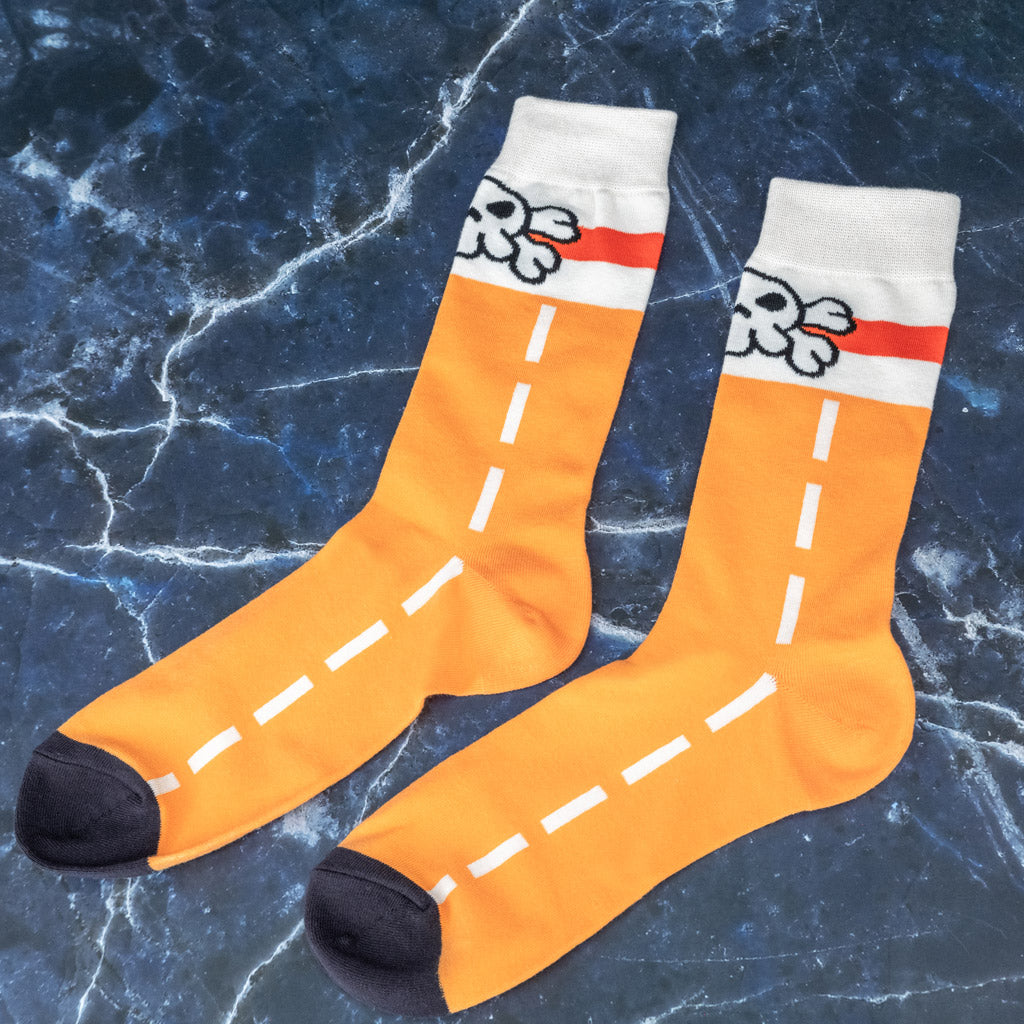 Flatlay photo of the Guilty Gear May socks inspired by the Jellyfish Pirates
