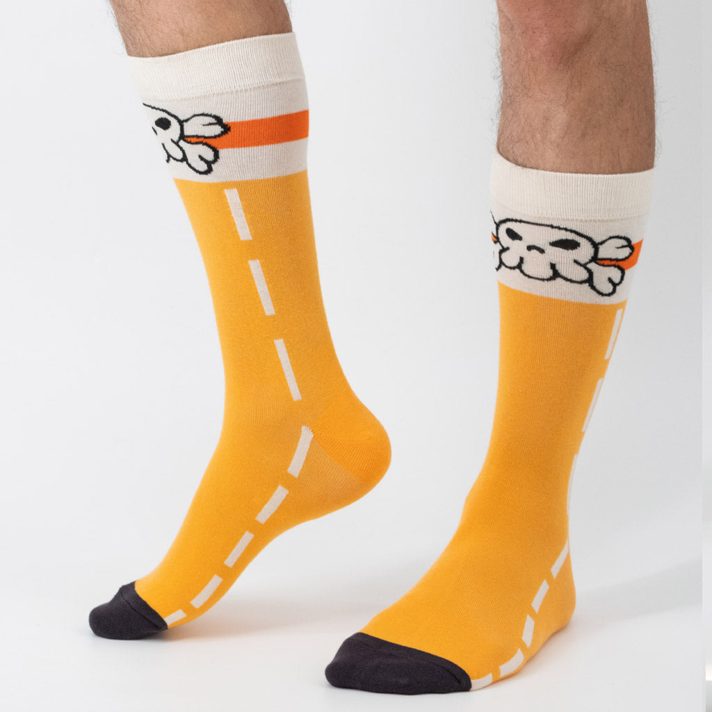Official Guilty Gear May socks with orange outfit featured on model.