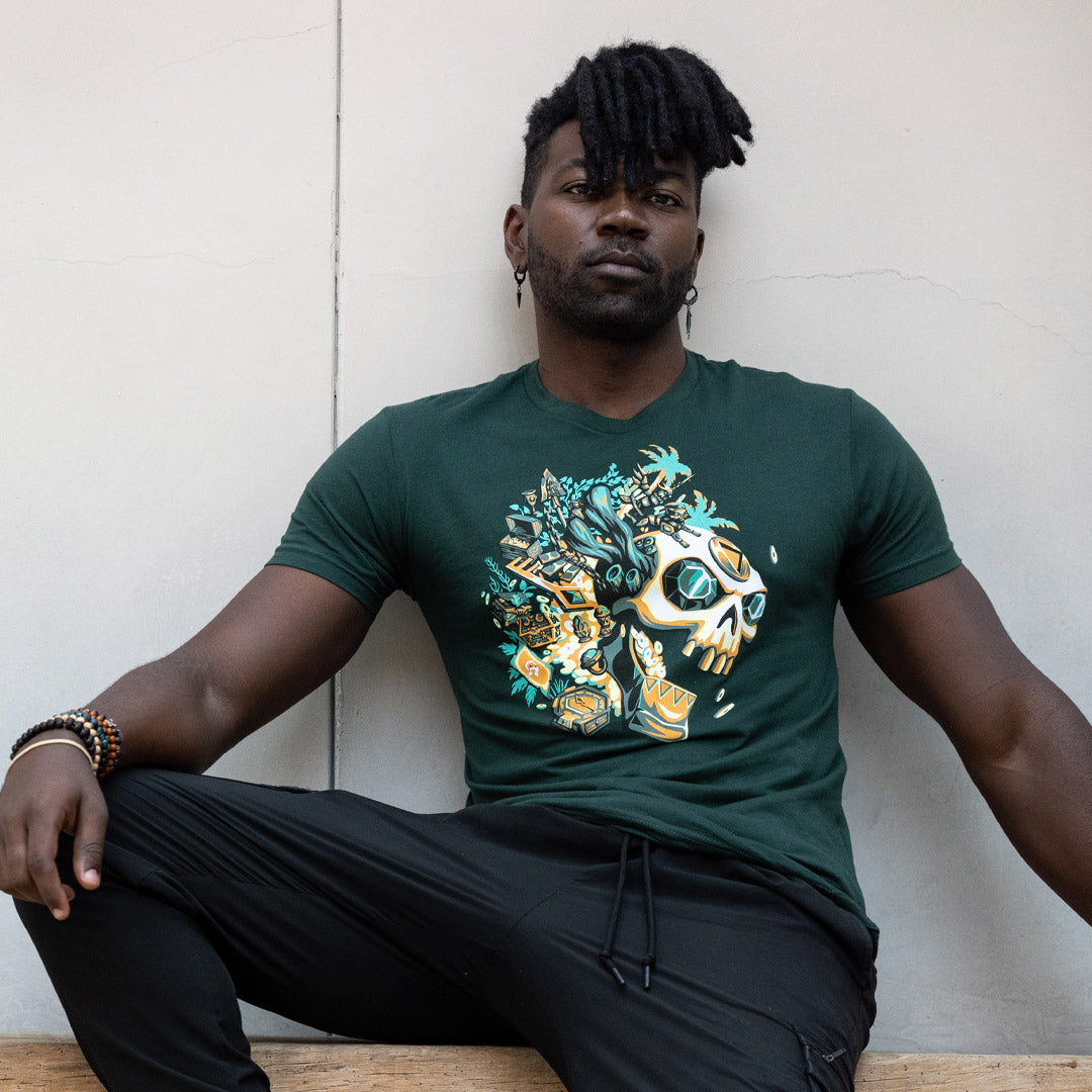 Man wearing the green Sea of Thieves Gold Hoarder t-shirt celebrating treasure hunts.