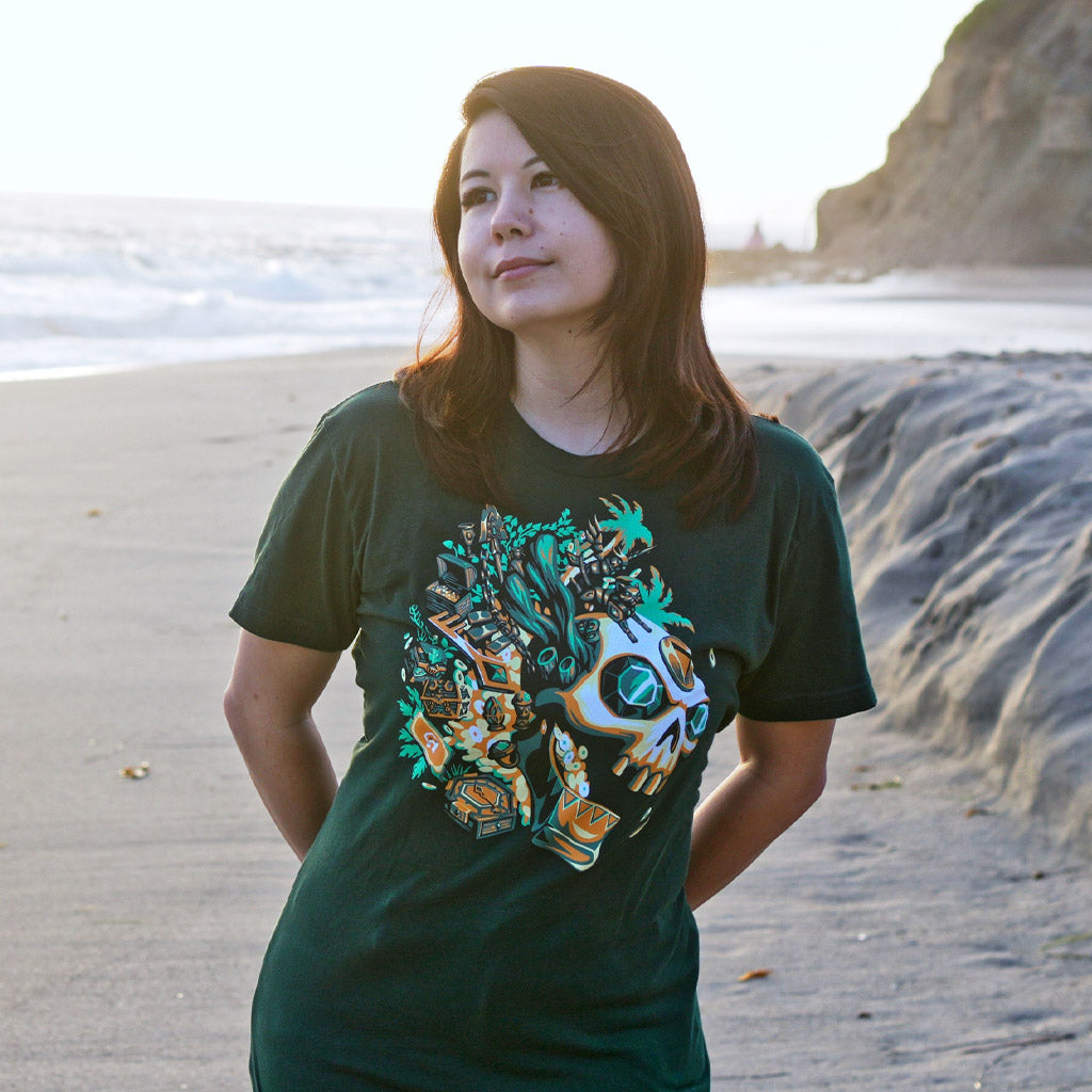 Woman wearing the Sea of Thieves Gold Hoarder T-Shirt featuring gold-obsessed faction artwork