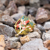 The Shin Megami Tensei V Amanozako pin is shown on a mix of volcanic rocks in different colors