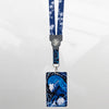 The Shin Megami Tensei V Fusion reversible lanyard is shown on a pixellated background.