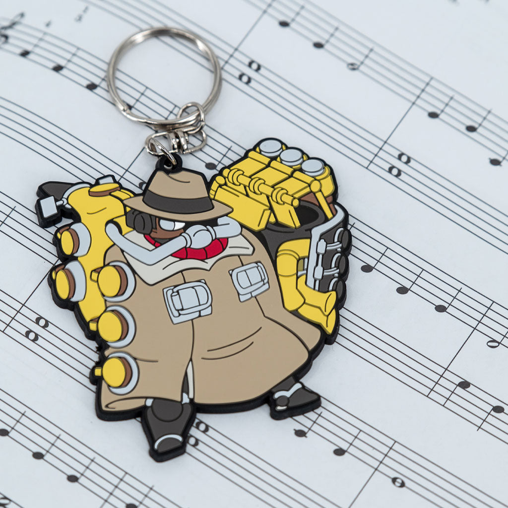 Skullgirls Big Band keychain proudly displayed on a sheet of music. 