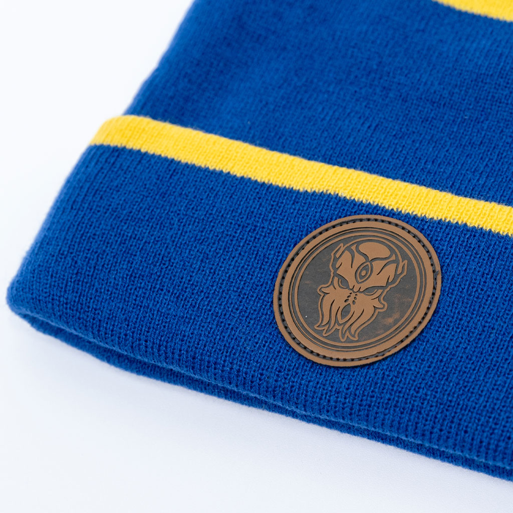 Close-up of Terraria Cultist Beanie patch showing Moon Lord design with gold and blue knit pattern