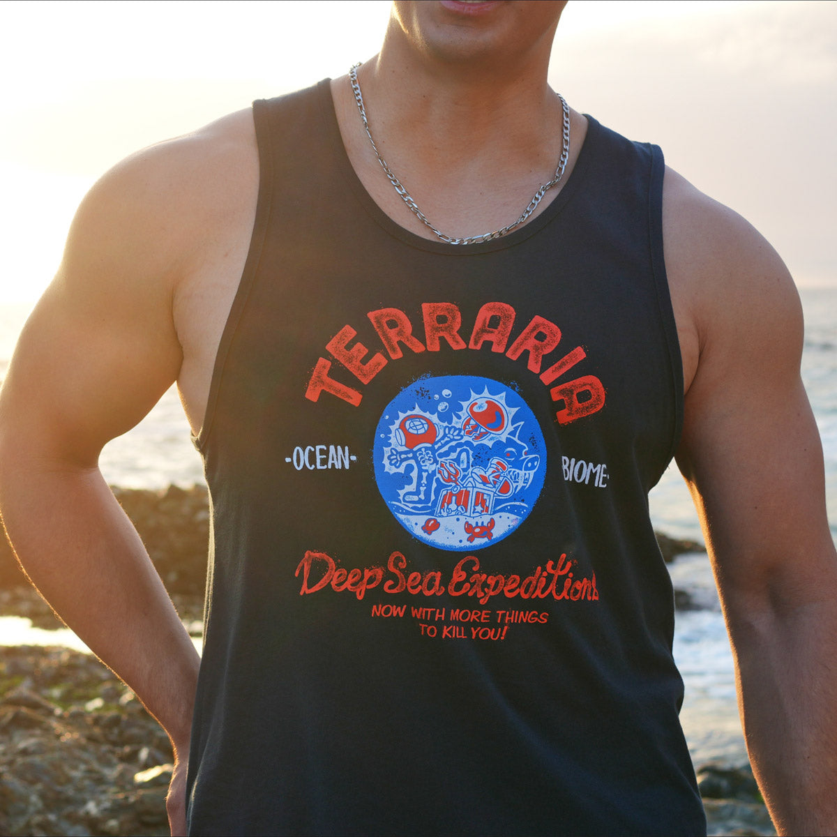 Closeup of model wearing the official Terraria Ocean Biome Tank Top showing the bold blue “Deep Sea Expeditions” design