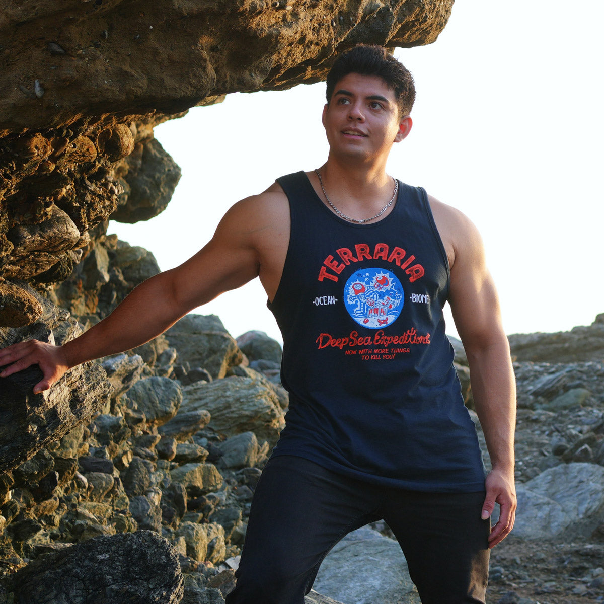 Mockup of Terraria Ocean Biome Tank Top featuring a circular deep-sea expedition design with character electrocuted by jellyfish and “Terraria” logo above