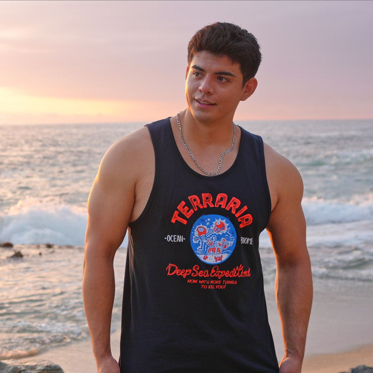 Terraria Ocean Biome Tank Top worn by model featuring the electrocuted character and “Now with more things to kill you!” text on the design