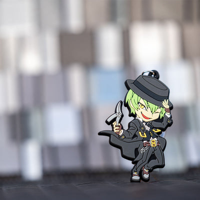 Image showcasing the Hazama keychain, set against a blurred background adorned with abstract squares, creating a visually interesting composition.