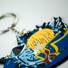 Detailed image featuring the Jin keychain, a piece of Blazblue merchandise, captured from an angled perspective.