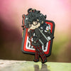 Photo of the Persona 5 Protagonist keychain featuring Morgana inside of Joker's Shujin Academy school bag.